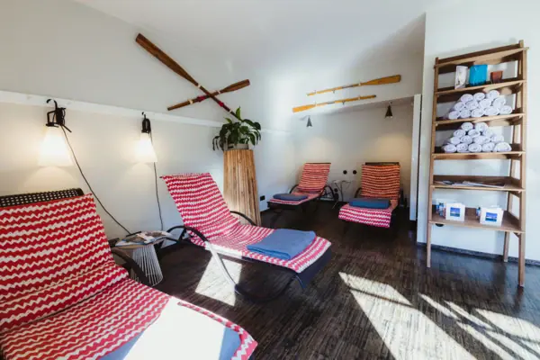 A room with chairs and a shelf.