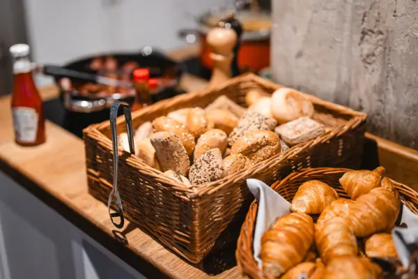 Baskets of bread and croissants on a counter