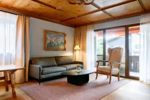 A living room with a sofa and a coffee table.