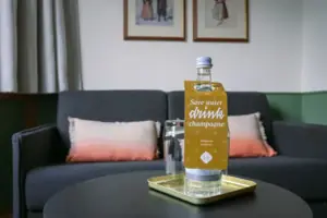 A bottle of water on a tray.
