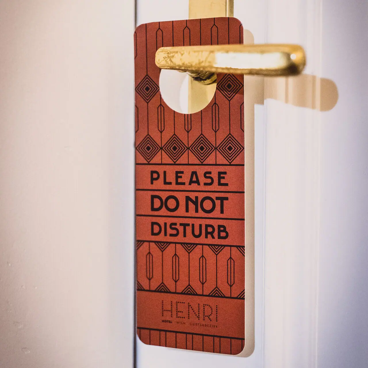 Door sign hanging on a door handle
