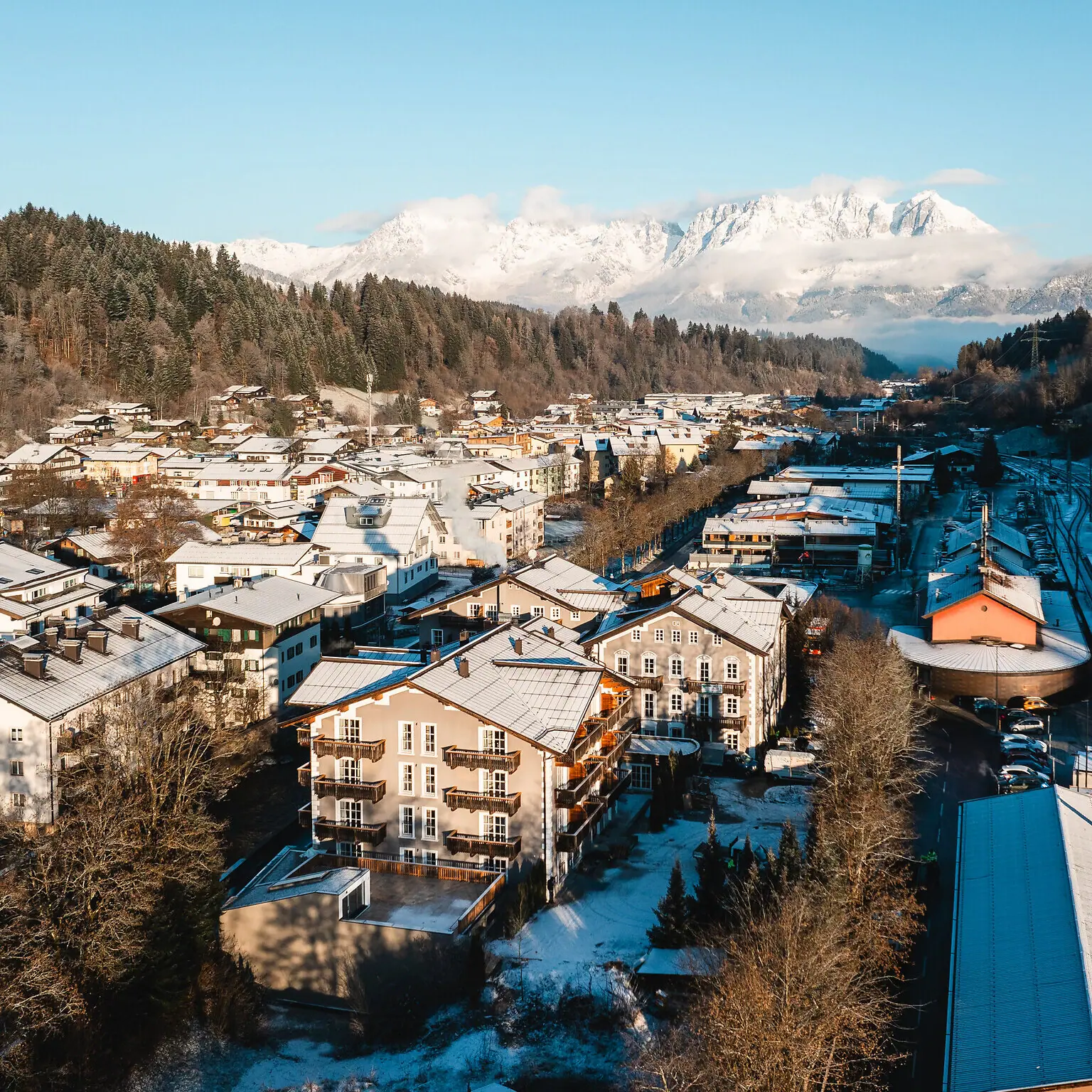 Snow-covered town in winter with houses in the background.