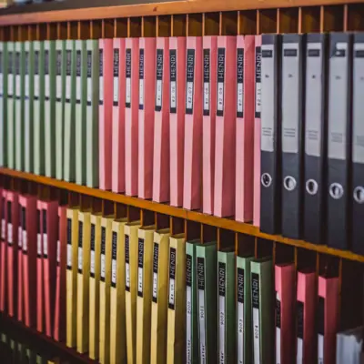 A shelf with folders.