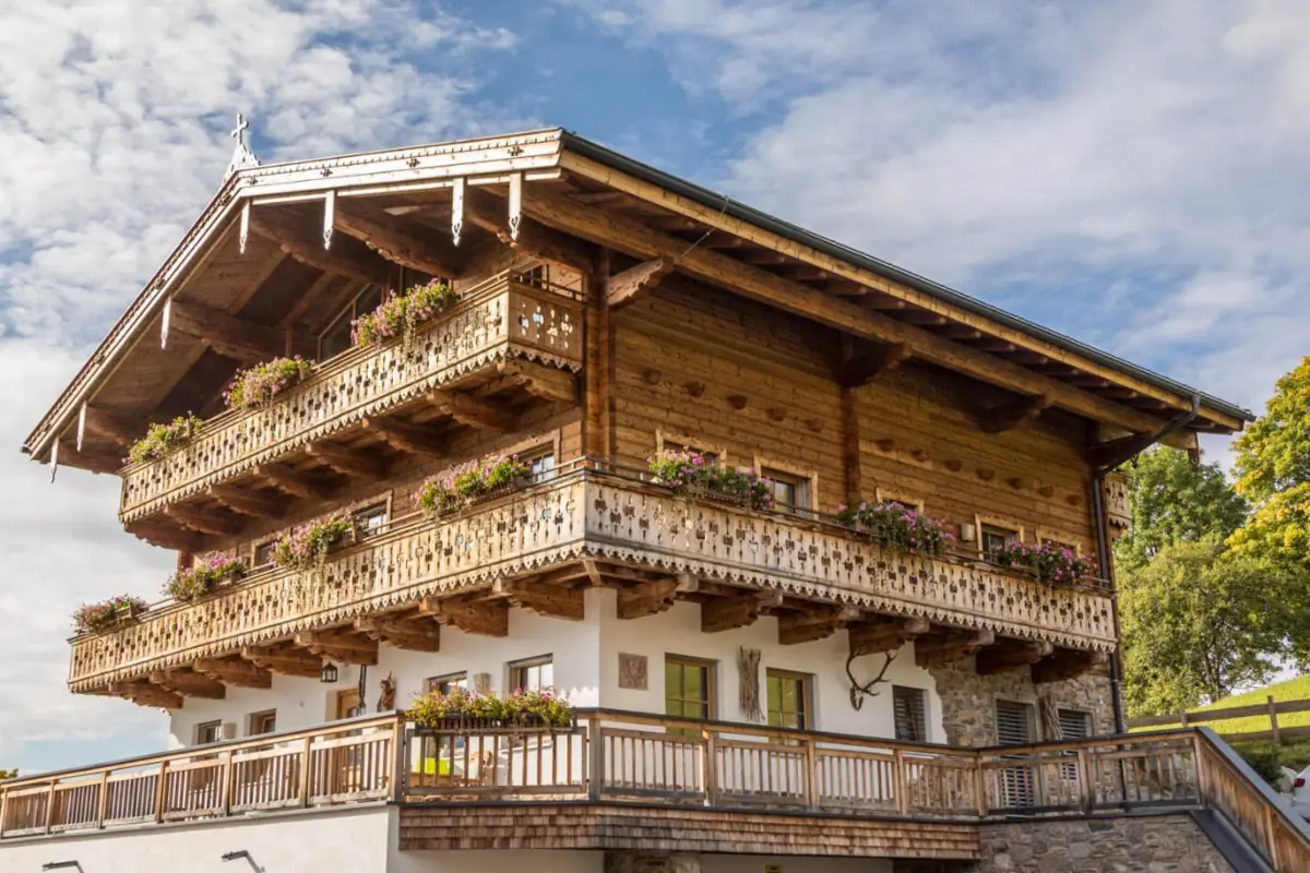 A building with a balcony against a blue sky.