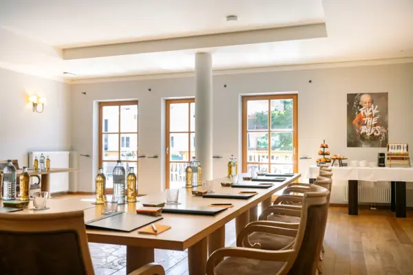 A room with a table and chairs.