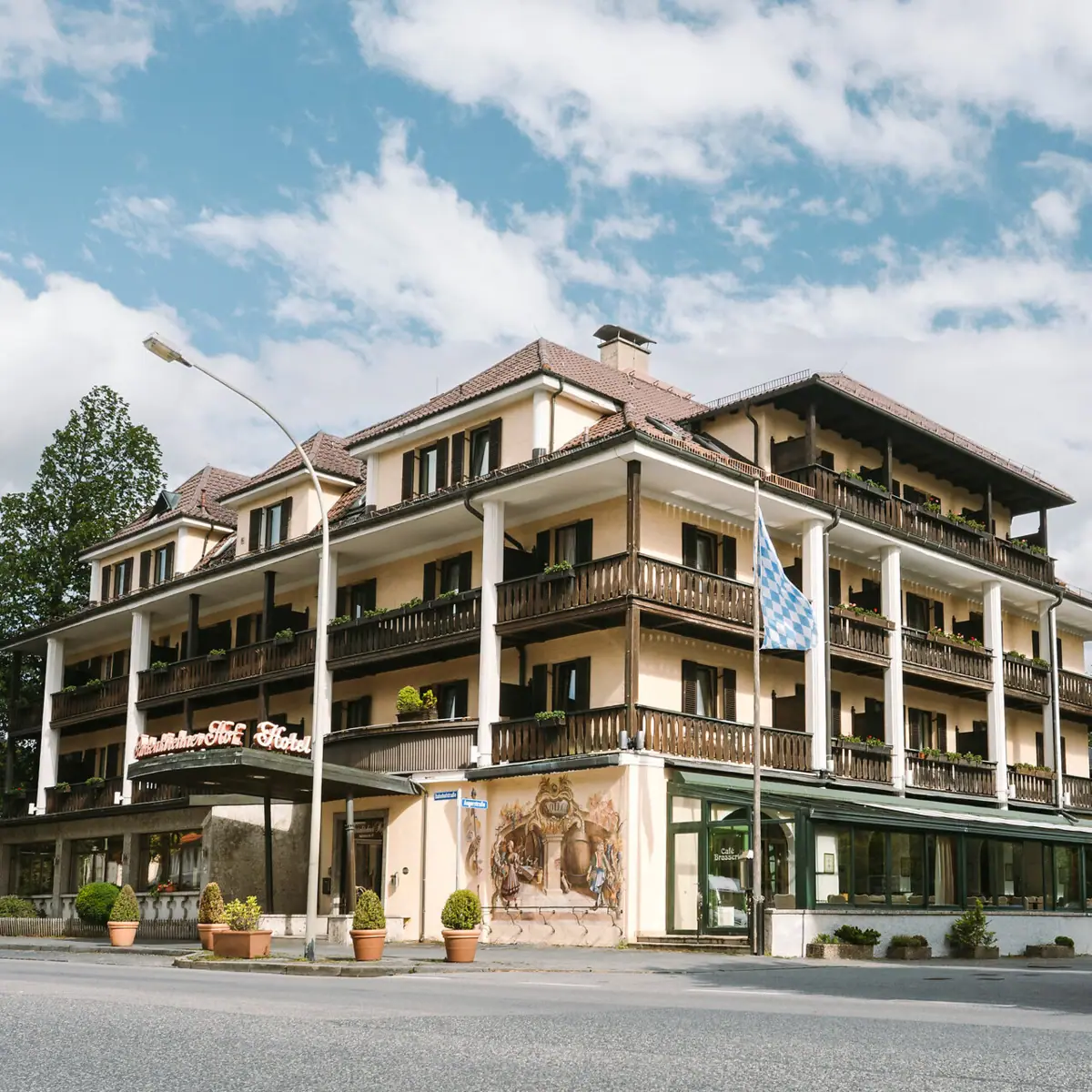 A building with many balconies and a flag.