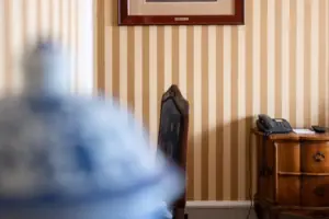 A framed picture on the wall in an interior.