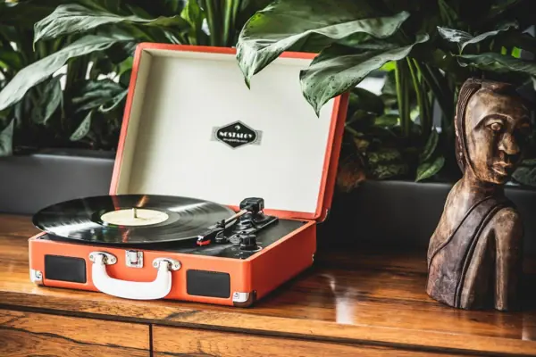 Orange record player with inserted record