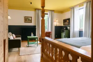 Room with a bed and a sofa