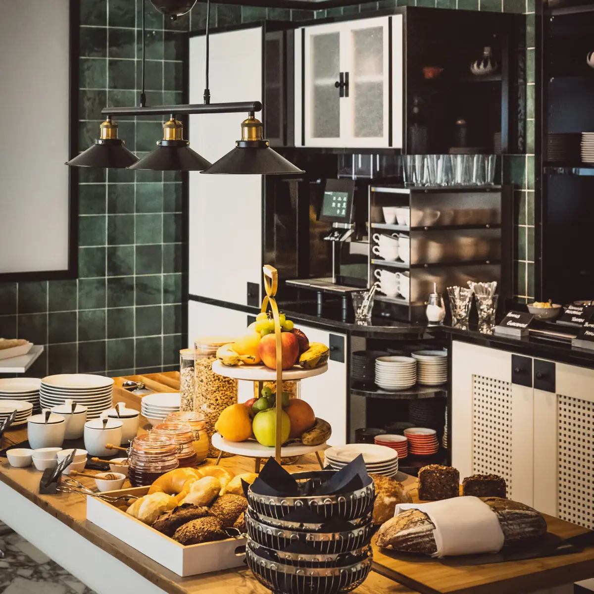 A kitchen with various dishes on the worktop.