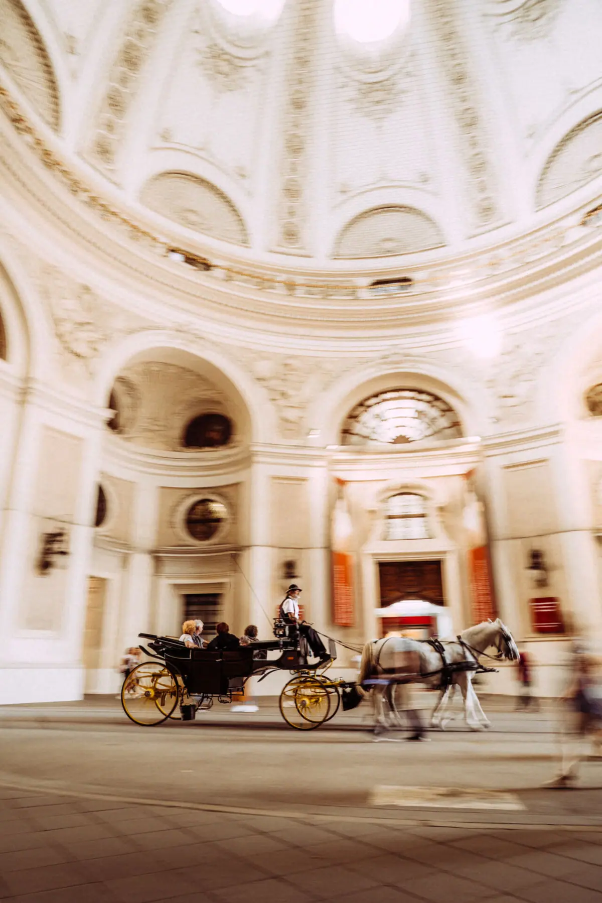 Horse-drawn carriage in a large building