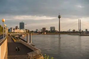 A body of water with a city in the background.