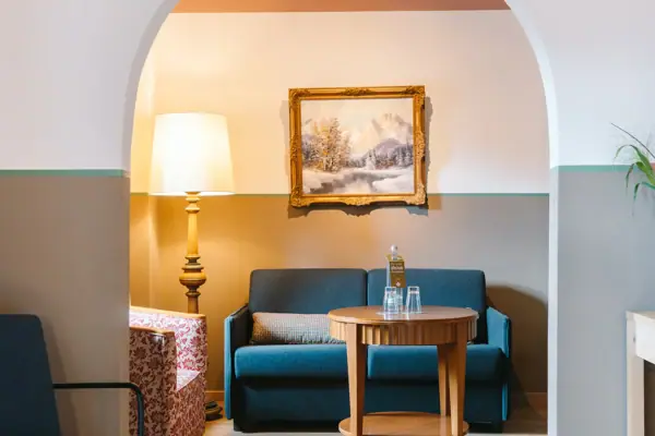 A room featuring a couch and a coffee table.