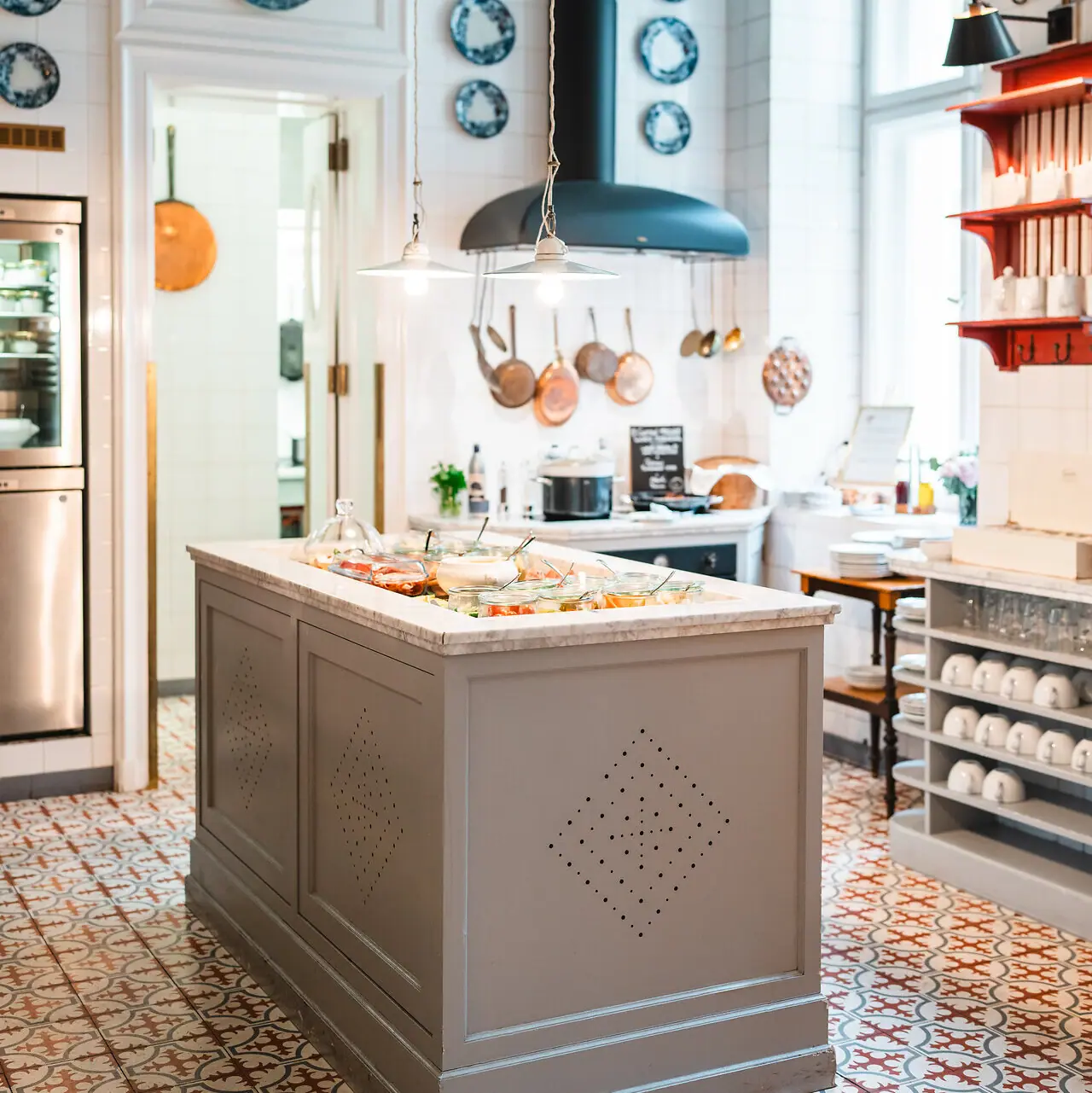 A kitchen with a large cooking island.
