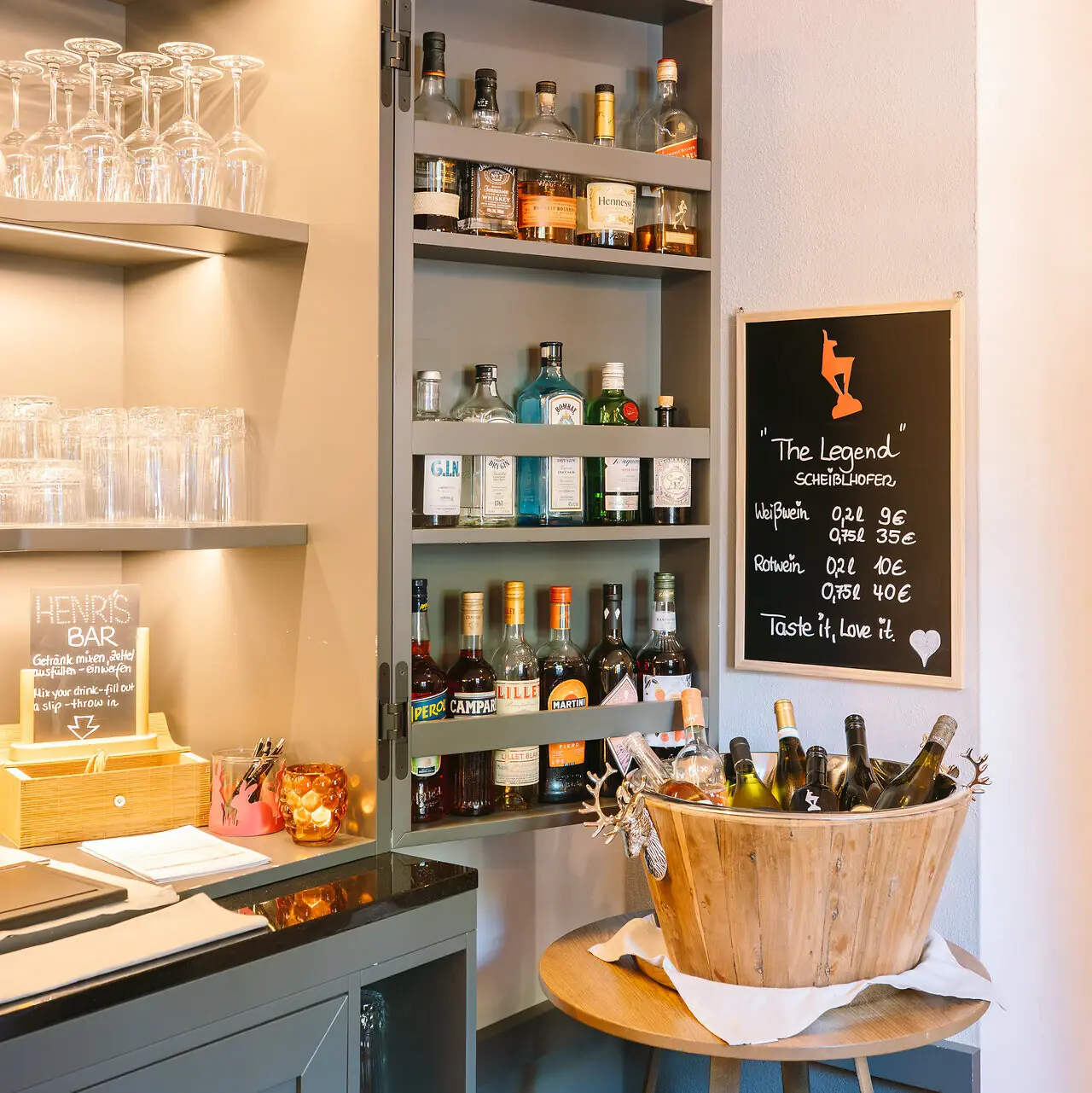 A shelf with bottles of alcohol.