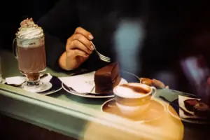 A person is eating a slice of cake.