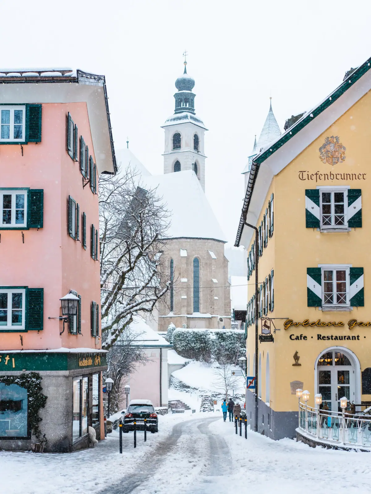 A group of buildings with snow on the ground.