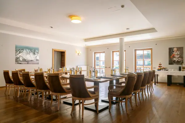 A room with a table and chairs.