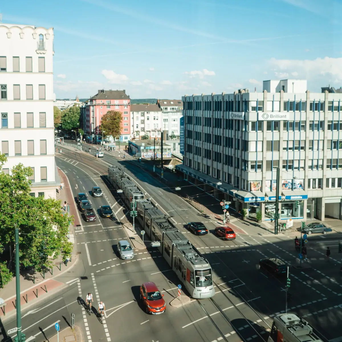 Street with cars and buildings in the background.