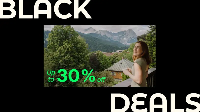 HENRI Hotels Black Deals A woman looking at a mountain range.
