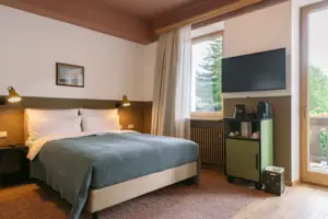 A bed in a bedroom with a stylish interior.