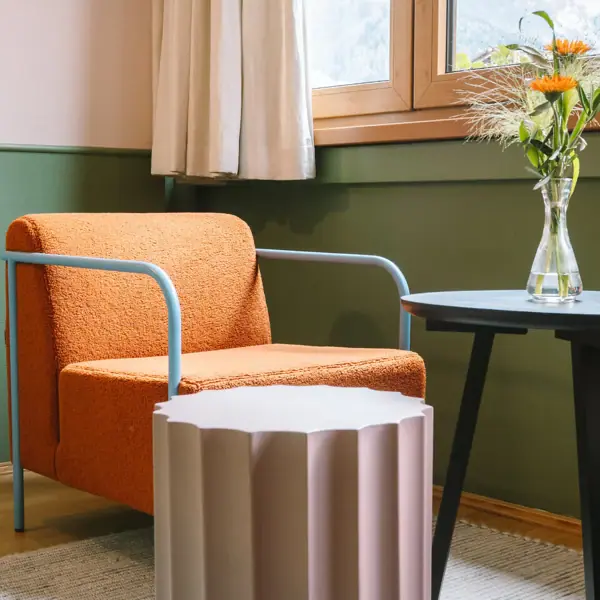 A chair and a table in one room.