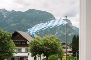A flag is flying above a building.