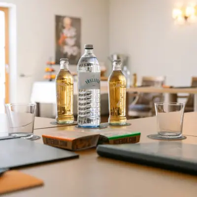 A group of bottles of liquid on a table.