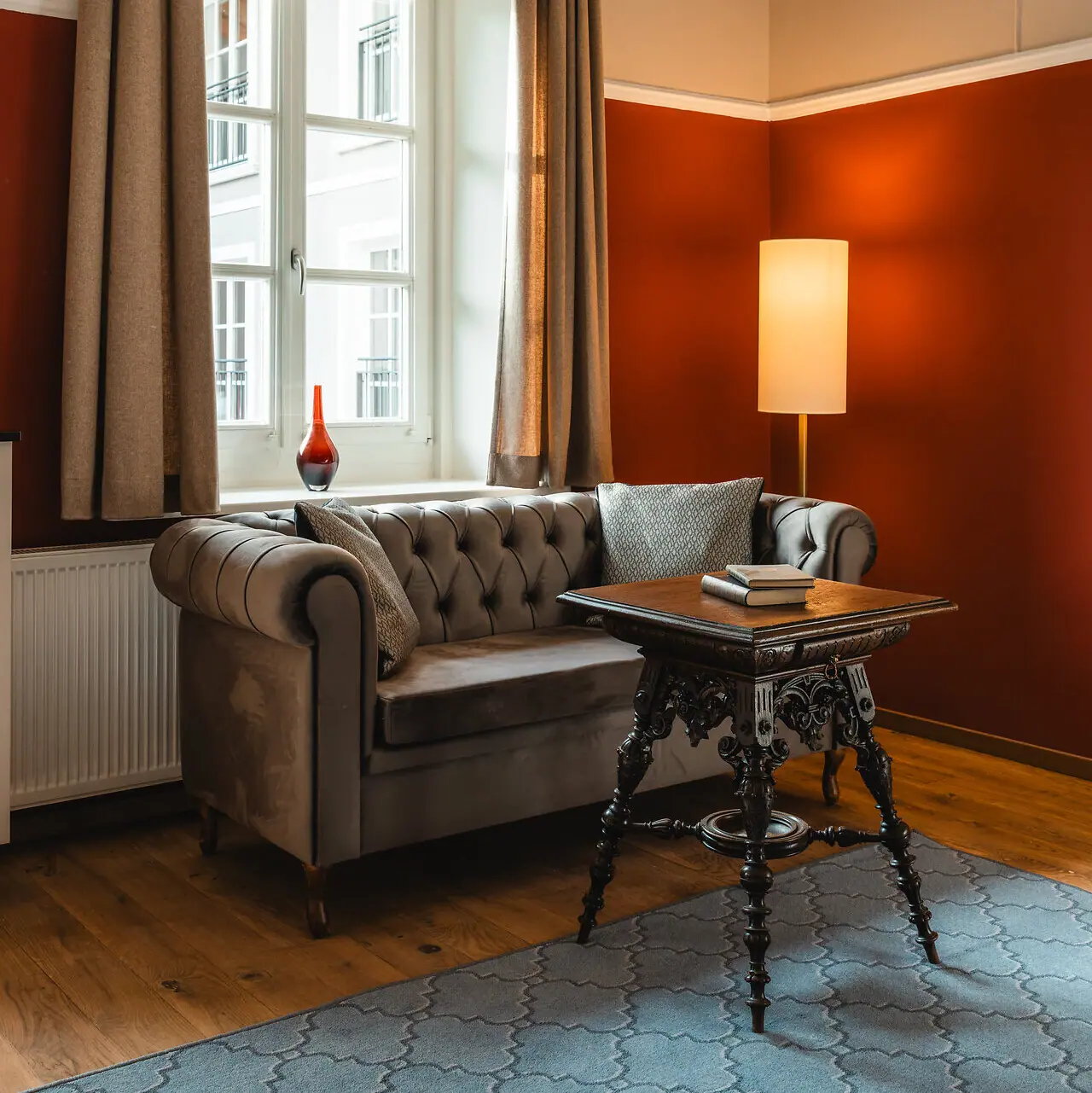 Couch and table in a stylishly furnished room.