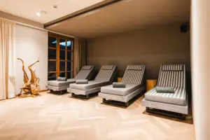 HENRI Kitzbühel Wellness Area A group of lounge chairs in a room.