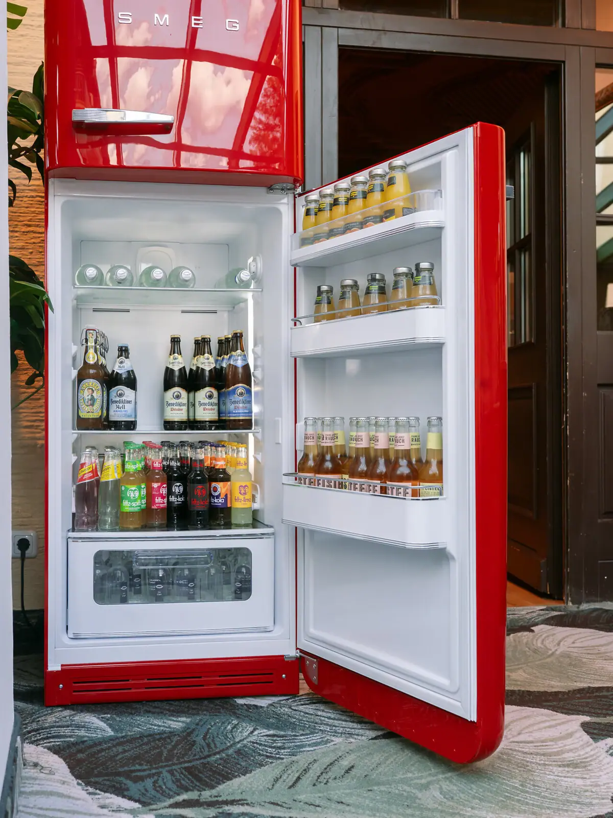 Refrigerator with bottles of beer inside.