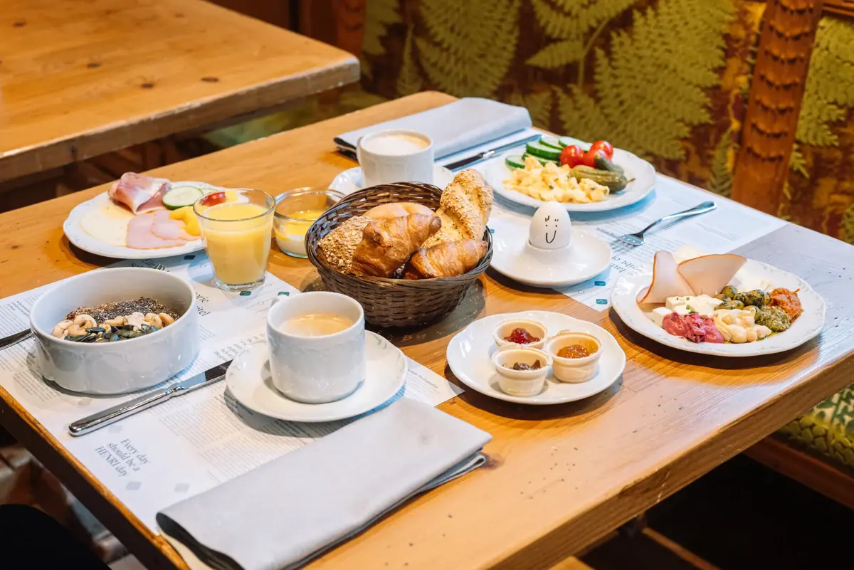 A table set with various dishes and tableware, showcasing a meal.