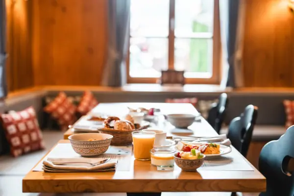 A table with various dishes and crockery on it.