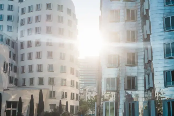A person is walking past a building.