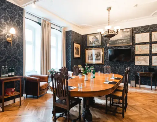 A room with a table and chairs.