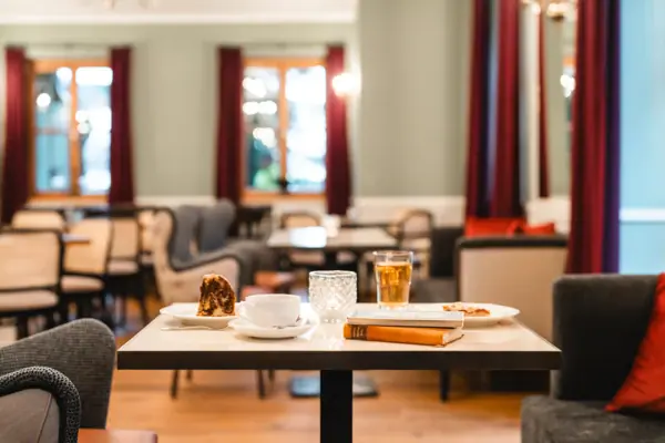 A table with various dishes on it.