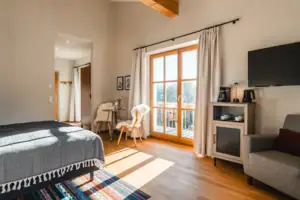 Bedroom with a television and a bed.