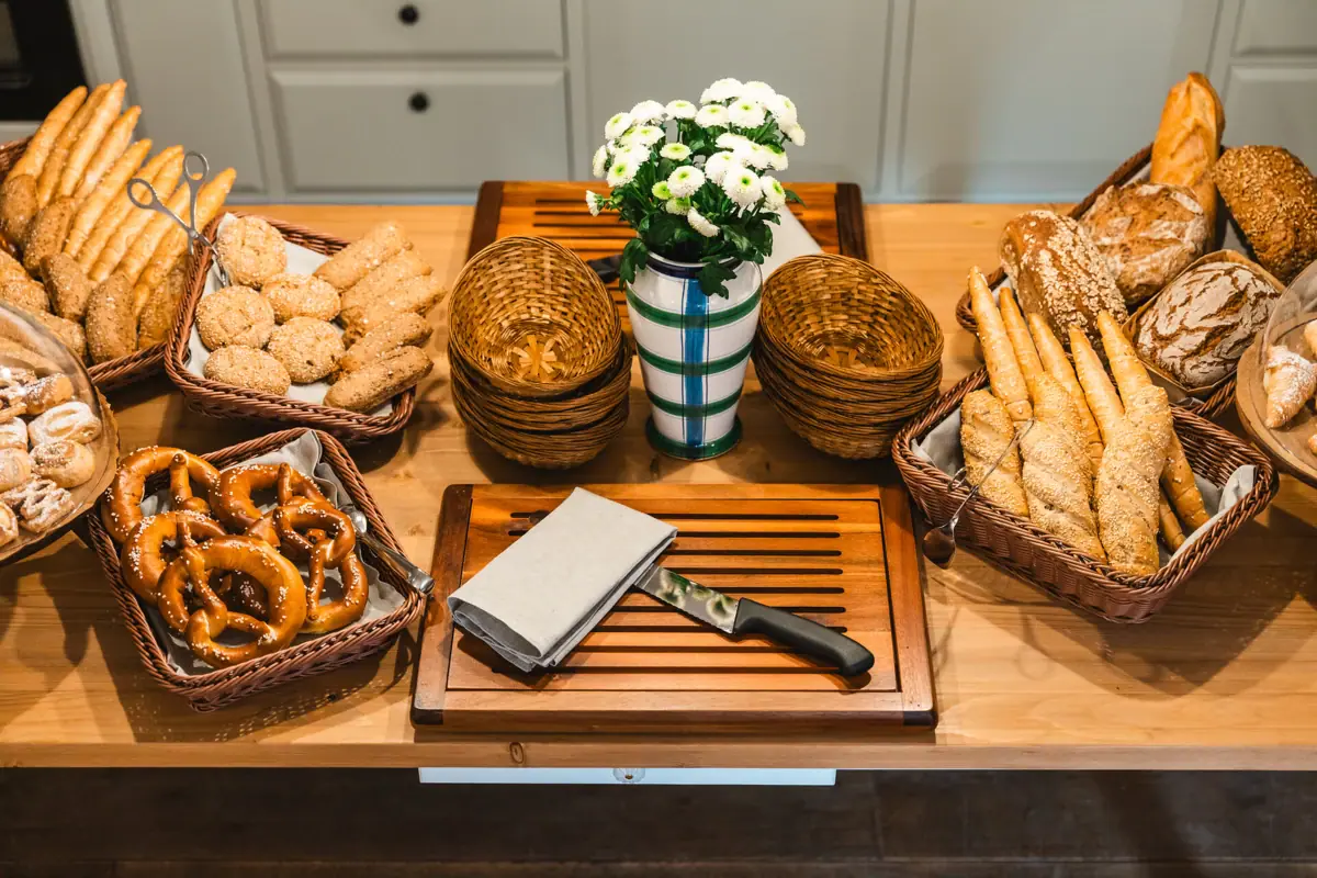 A table with bread and rolls.