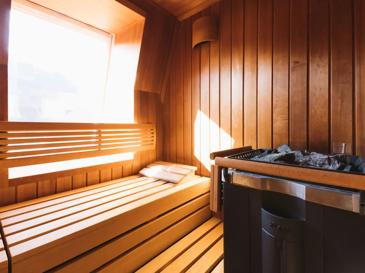 Finnish wood sauna with window and stove