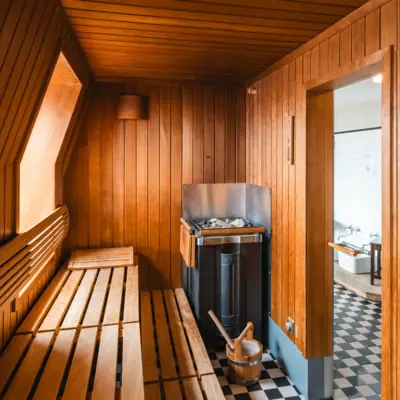 Finnish sauna with heater and water bucket