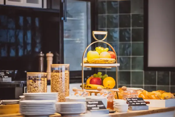 A table with plates and dishes on it.