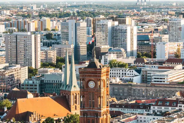 Large city with a clock tower in the foreground.