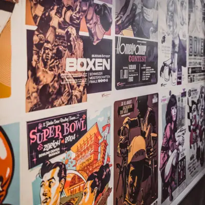 A wall with posters.