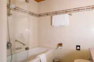 Bathroom with a glass door on the shower and modern fittings.