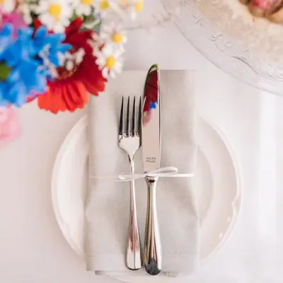Fork and knife on a napkin with flowers