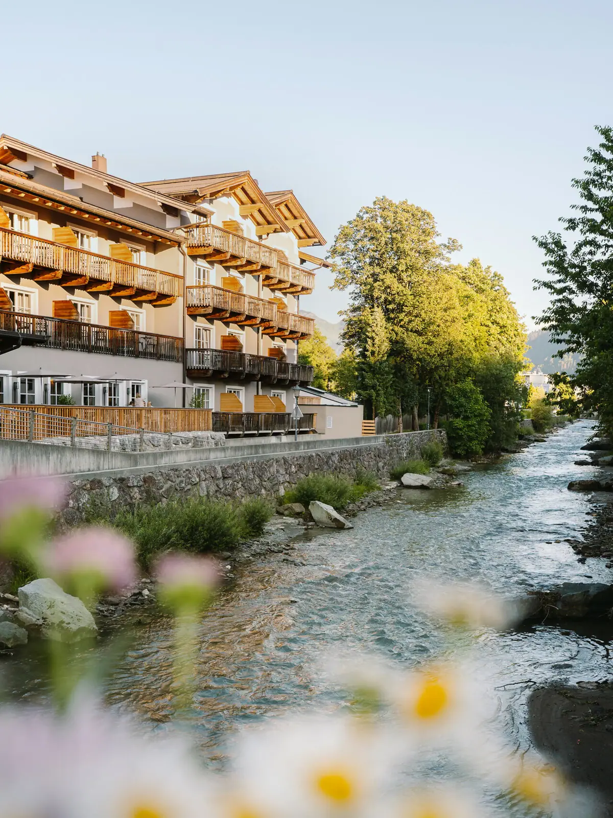 A hotel by a river. 