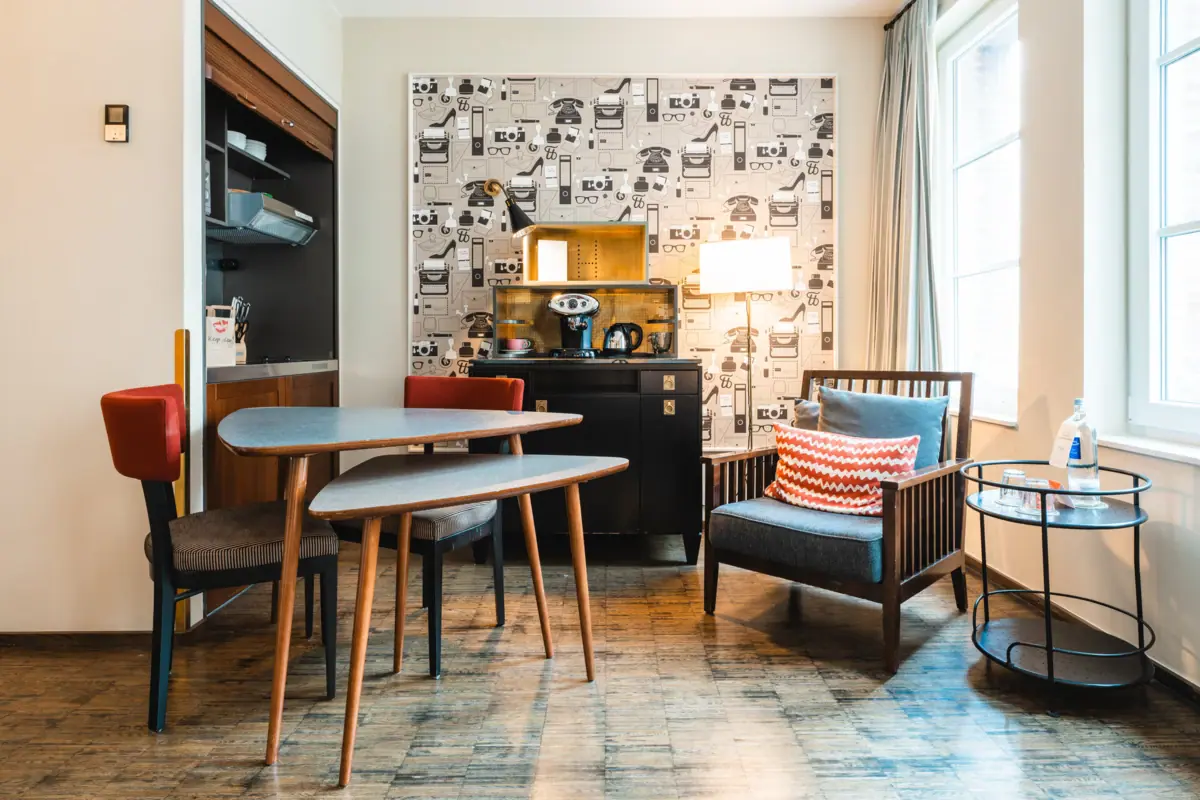 A room with a table and chairs.