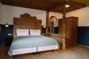 A bed in a room with modern décor.