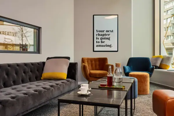 A room with a sofa and a coffee table.