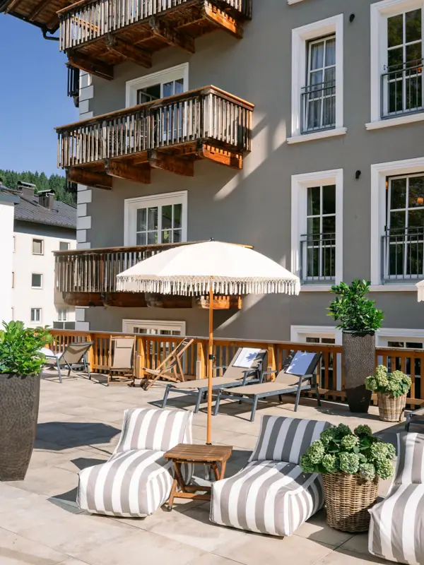 Terrace with chairs and parasol